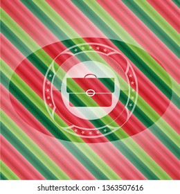 briefcase icon inside christmas style badge..