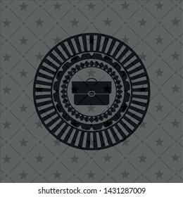 briefcase icon inside dark badge or emblem
