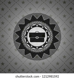 briefcase icon inside dark emblem