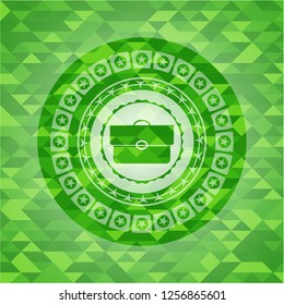 briefcase icon inside green emblem with triangle mosaic background