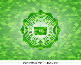 briefcase icon inside green emblem with mosaic ecological style background