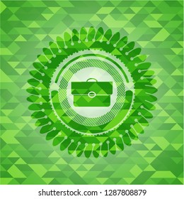 briefcase icon inside green emblem with mosaic background