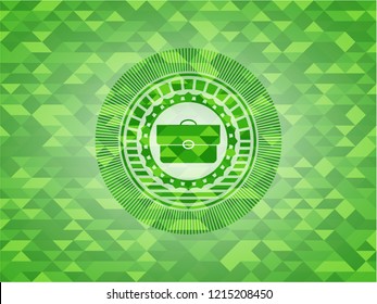 briefcase icon inside green mosaic emblem