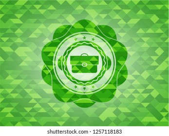 briefcase icon inside green mosaic emblem