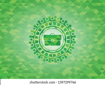 briefcase icon inside green mosaic emblem