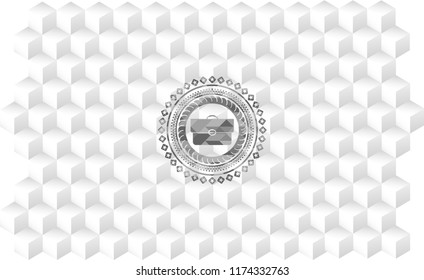briefcase icon inside grey badge with geometric cube white background