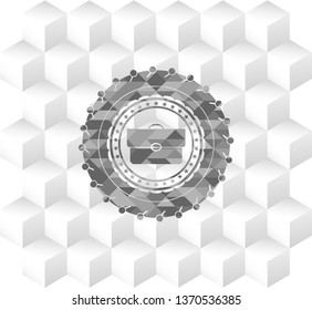 briefcase icon inside grey badge with geometric cube white background