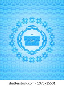briefcase icon inside light blue water wave style emblem.