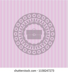 briefcase icon inside pink emblem