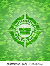 briefcase icon inside realistic green mosaic emblem