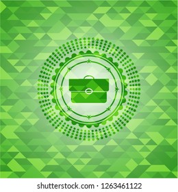 briefcase icon inside realistic green mosaic emblem