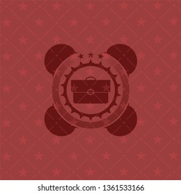 briefcase icon inside retro red emblem