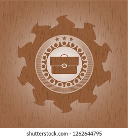 briefcase icon inside retro style wood emblem