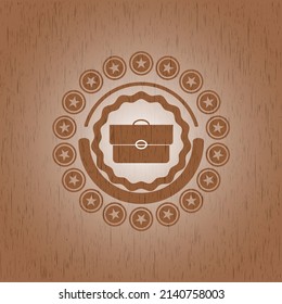 briefcase icon inside retro wood emblem. 
