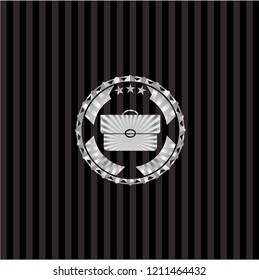 briefcase icon inside silver emblem or badge