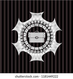 briefcase icon inside silver shiny badge