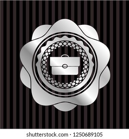 briefcase icon inside silver shiny emblem