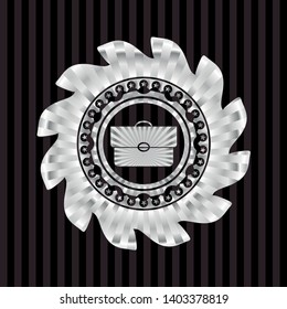 briefcase icon inside silver shiny emblem