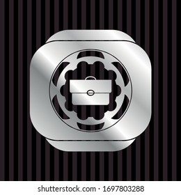 briefcase icon inside silvery badge