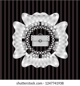 briefcase icon inside silvery emblem or badge