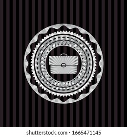 briefcase icon inside silvery emblem