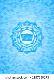briefcase icon inside sky blue mosaic emblem