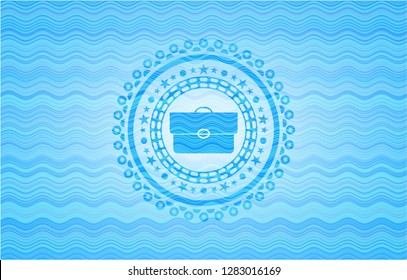 briefcase icon inside sky blue water wave style badge.