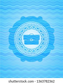 briefcase icon inside sky blue water style emblem.