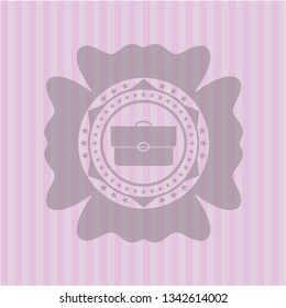 briefcase icon inside vintage pink emblem