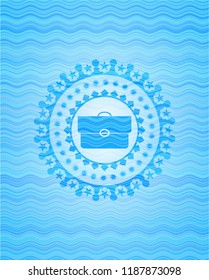 briefcase icon inside water concept emblem background.