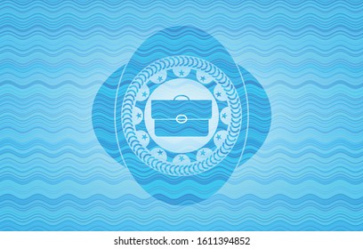 briefcase icon inside water concept emblem background.