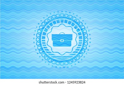 briefcase icon inside water wave representation badge.