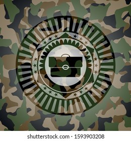 briefcase icon on camouflaged texture