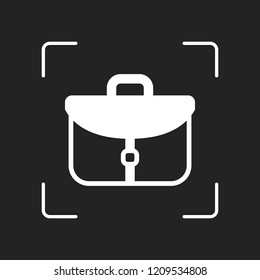 Briefcase, office bag. White object in camera autofocus on dark background