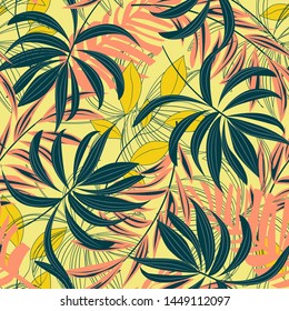 Bright abstract seamless pattern with colorful tropical leaves and plants on yellow background. Vector design. Jungle print. Floral background. Printing and textiles. Exotic tropics. Fresh design.
