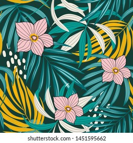 Bright abstract seamless pattern with colorful tropical leaves and flowers on green background. Vector design. Jungle print. Floral background. Printing and textiles. Exotic tropics. Fresh design.