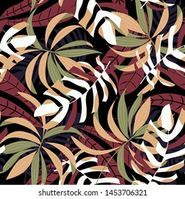 Bright abstract seamless pattern with colorful tropical leaves and plants on black background. Vector design. Jungle print. Floral background. Printing and textiles. Exotic tropics. Fresh design.