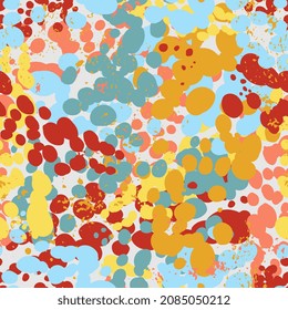 Bright abstract seamless pattern with stains, splashes of paint and candy. Festive background