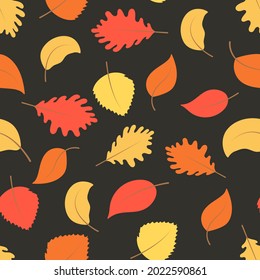 Bright autumn leaves on a dark background seamless pattern. Yellow red and orange sheets, vector illustration. Fall seasonal background.
