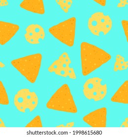 Bright background with nachos and a slice of cheese on a blue background 