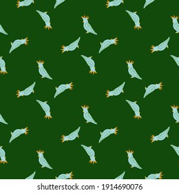 Bright blue cockatoo parrot silhouettes seamless doodle pattern. Green bright background. Simple design. Flat vector print for textile, fabric, giftwrap, wallpapers. Endless illustration.