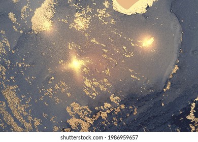 Bright blue, gray and gold abstract background. Alcohol ink marble texture with glitter. Template pattern for banner, poster design. Fluid art painting
