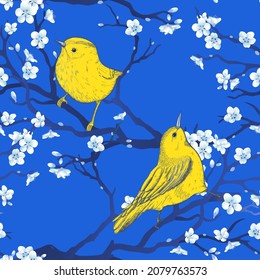 Bright blue oriental seamless pattern with vintage birds and sakura tree branches. Vector design with amazing birds. Decorative oriental illustration for wallpaper, fashion, packaging print.