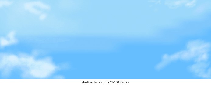 Bright blue sky filled with soft white clouds on a clear sunny day.
