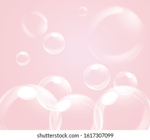 bright blue soap bubbles on pink background
