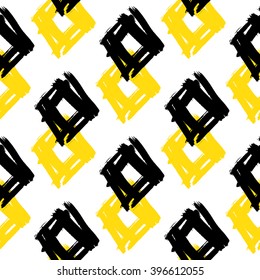 Bright brushstrokes seamless bold pattern. Hand painted rhombus vector texture. Yellow, black, white colors.