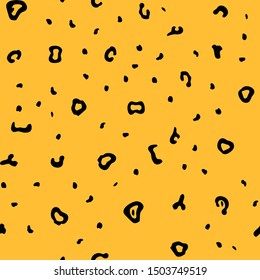 Bright cartoon leopard skin with little black spots seamless pattern