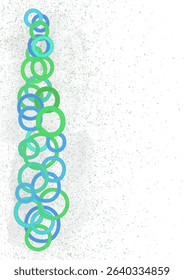 Bright cheerful greeting card design without text. Multicolored rings in rich summer tones. Abstract composition of circles. Many random blue green rings on abstract spotted background