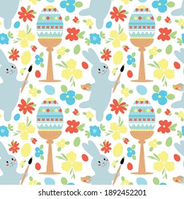 Bright childish pattern with a bunny painting an Easter egg on a white background with spring flowers. Vector seamless ornament.