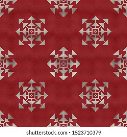 Bright Christmas knitted seamless pattern with white snowflakes on a red background